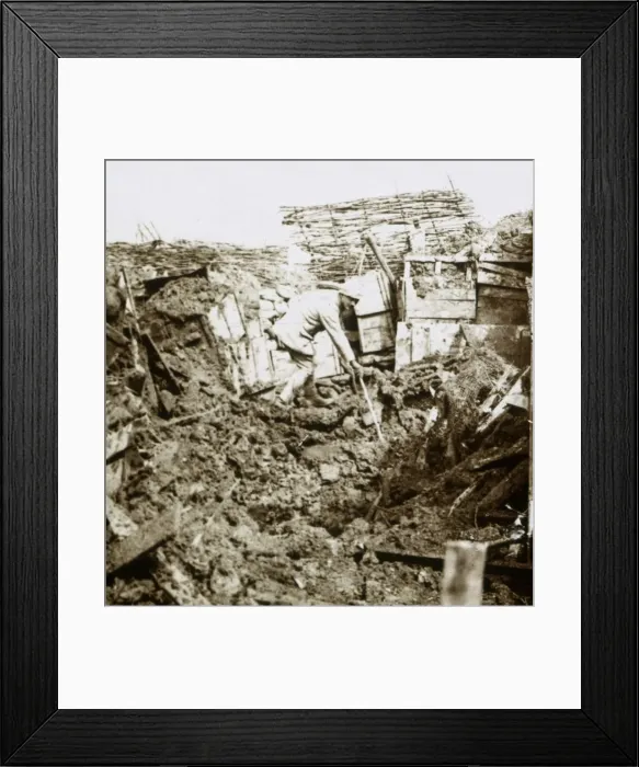 Framed Print : Aftermath of a shell, a soldier in the crater, c1914-c1918 Framed Print : Aftermath of a shell, a soldier in the crater, c1914-c1918