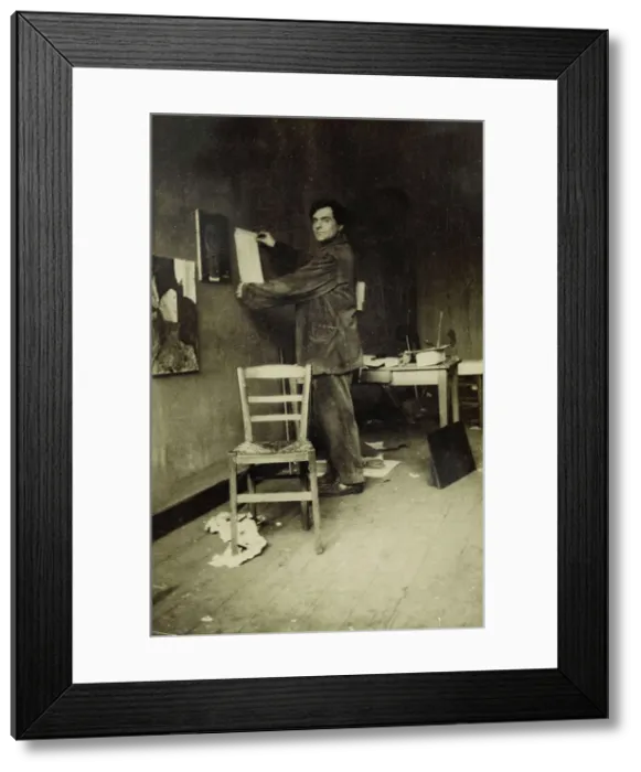 Framed Print : Amedeo Modigliani in his studio, c. 1915 Framed Print : Amedeo Modigliani in his studio, c. 1915