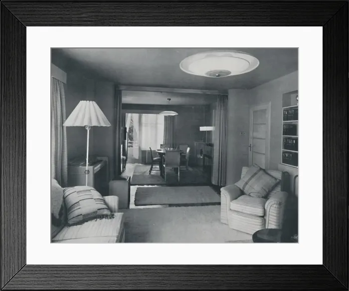 Framed Print : Dining and living room, divided only by heavy curtains in an attractive modern weave, 1942 Framed Print : Dining and living room, divided only by heavy curtains in an attractive modern weave, 1942