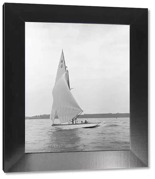 The 7 Metre Ancora (K3) sailing under spinnaker, 1913. Creator: Kirk & Sons of Cowes