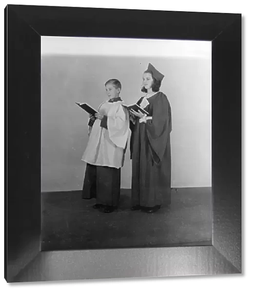 Girl and boy chorister, (Isle of Wight?), c1935. Creator: Kirk & Sons of Cowes