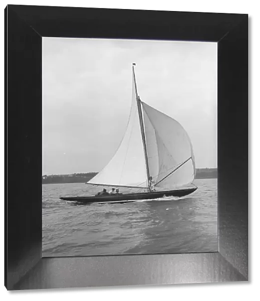 The 7 Metre Anitra (K4) sailing with spinnaker, 1913. Creator: Kirk & Sons of Cowes