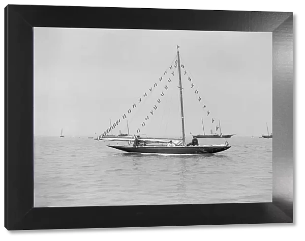 The 6 Metre Cremona moored with flags, 1913. Creator: Kirk & Sons of Cowes