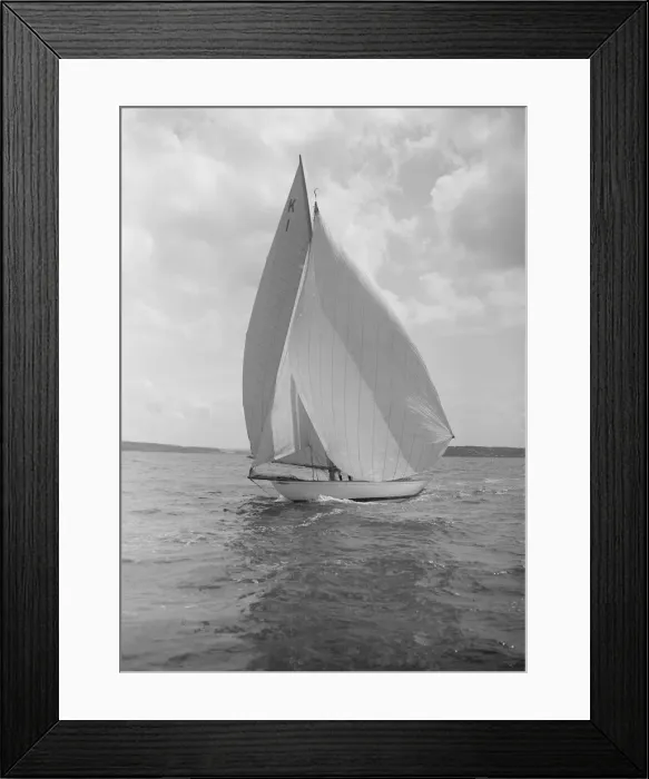 Framed Print : The 7 Metre Marsinah (K1) sailing with spinnaker, 1912. Creator: Kirk & Sons of Cowes