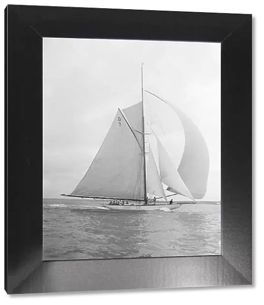 Istria sailing downwind under spinnaker, 1912. Creator: Kirk & Sons of Cowes