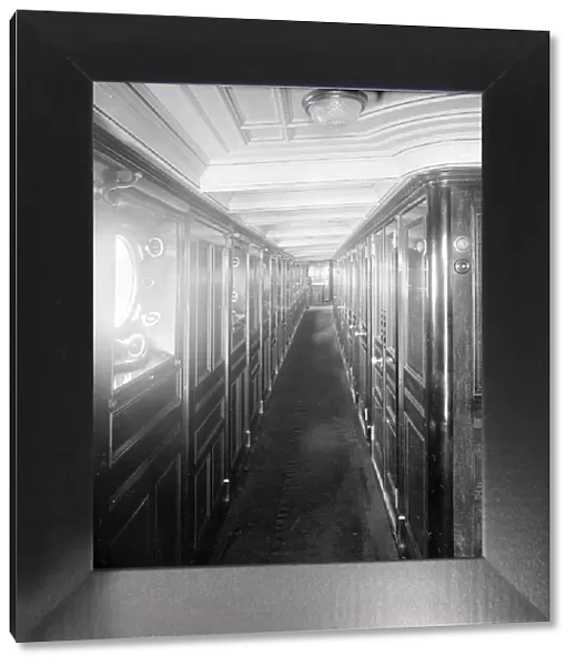 Long wood panelled corridor on steam yacht Venetia, 1920. Creator: Kirk & Sons of Cowes