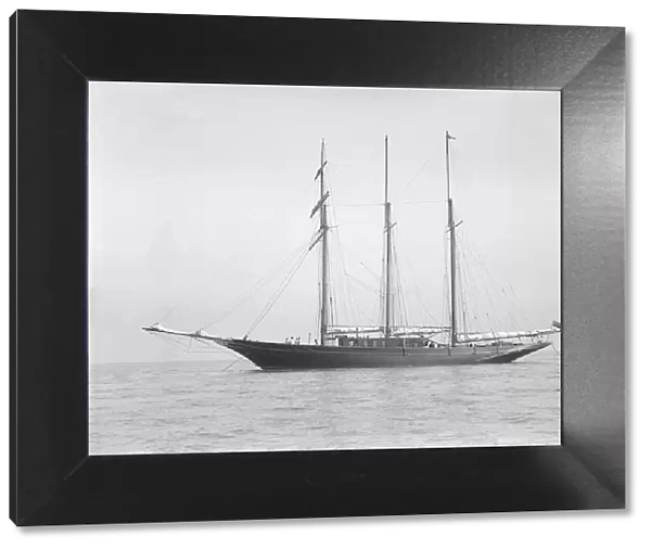 The auxiliary schooner La Cigale at anchor, 1913. Creator: Kirk & Sons of Cowes