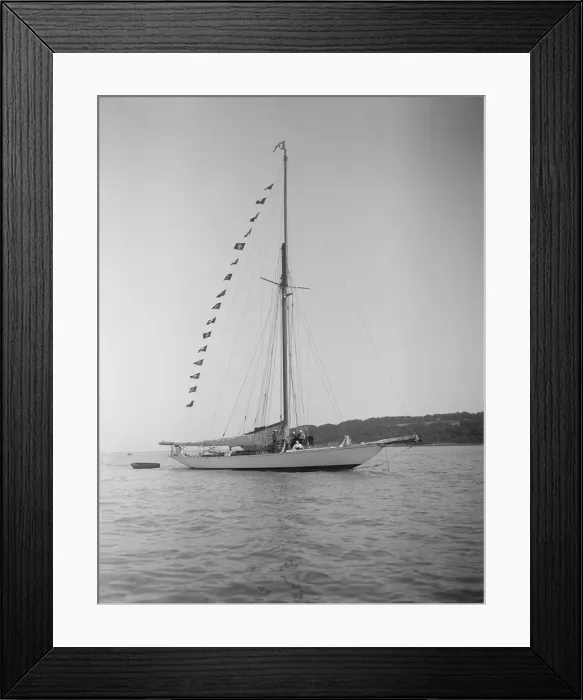 Framed Print : The 40-rater cutter Carina at anchor with flags, 1911. Creator: Kirk & Sons of Cowes Framed Print : The 40-rater cutter Carina at anchor with flags, 1911. Creator: Kirk & Sons of Cowes