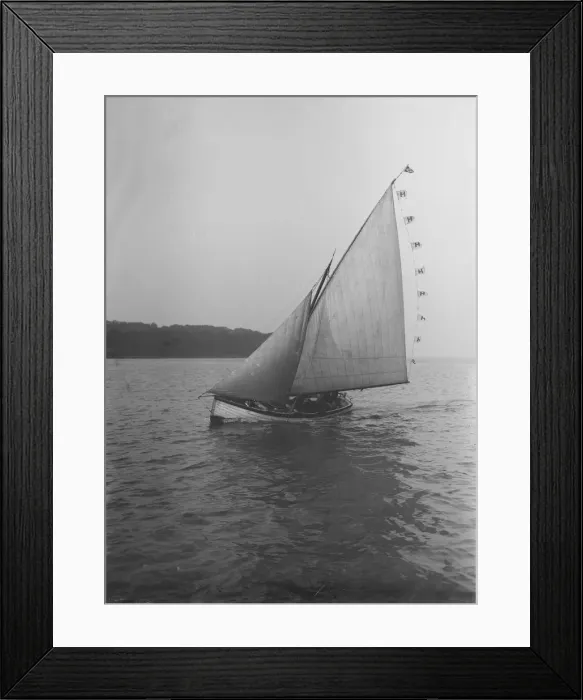 Framed Print : The sailing dinghy Hound with flags, 1912. Creator: Kirk & Sons of Cowes
