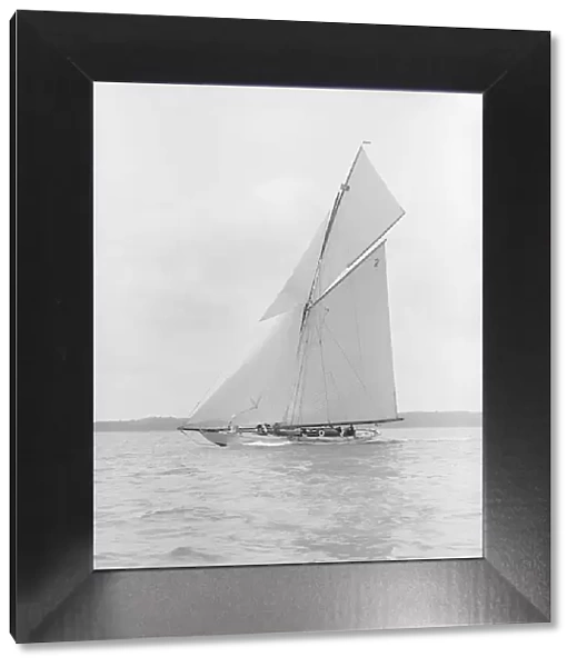 The 40-rater cutter Carina sailing close-hauled, 1913. Creator: Kirk & Sons of Cowes