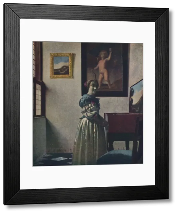 Framed Print : A Lady Standing at the Virginals, c1670-1672, (c1950). Creator: Jan Vermeer Framed Print : A Lady Standing at the Virginals, c1670-1672, (c1950). Creator: Jan Vermeer