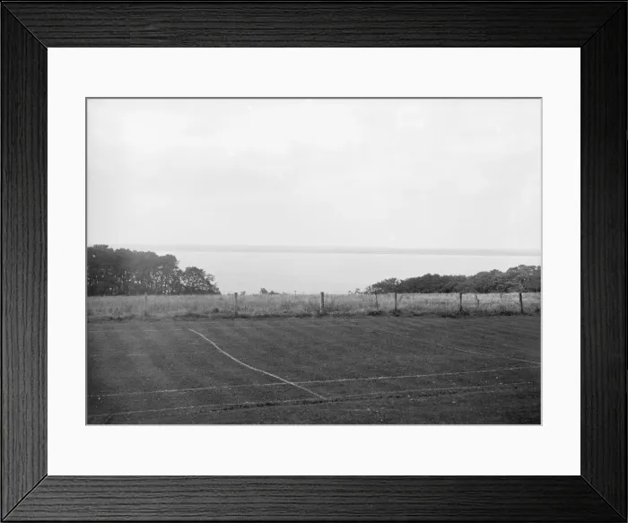 Framed Print : View of a tennis court and the sea, c1935. Creator: Kirk & Sons of Cowes Framed Print : View of a tennis court and the sea, c1935. Creator: Kirk & Sons of Cowes