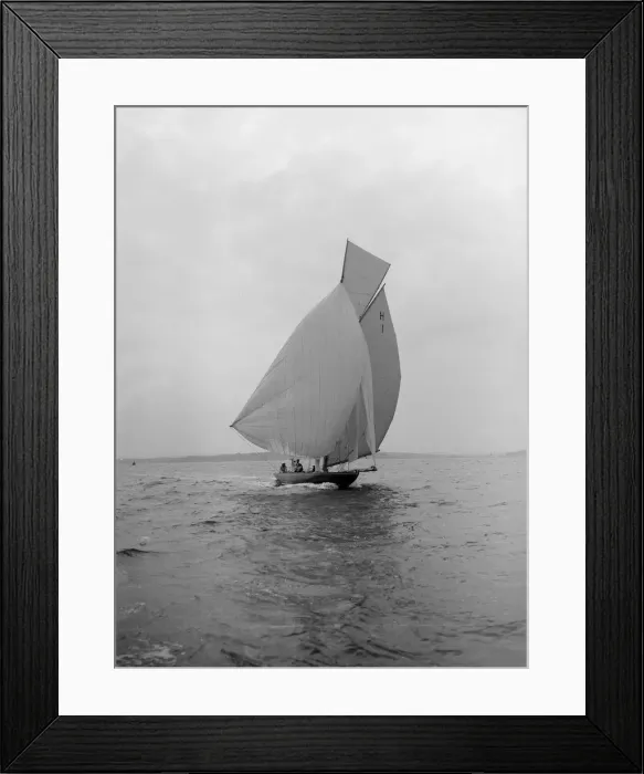 Framed Print : The 8 Metre class Antwerpia IV sailing under spinnaker, 1912. Creator: Kirk & Sons of Cowes