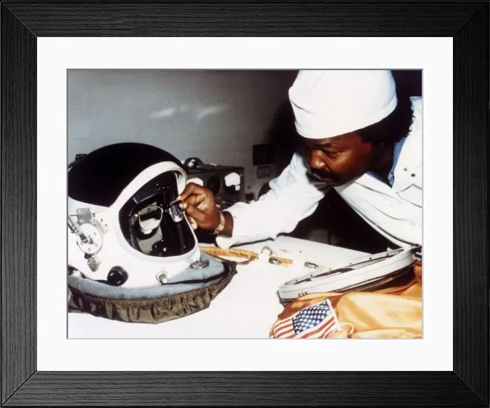 Framed Print : Technician installing eye-glasses in helmet. Creator: NASA Framed Print : Technician installing eye-glasses in helmet. Creator: NASA