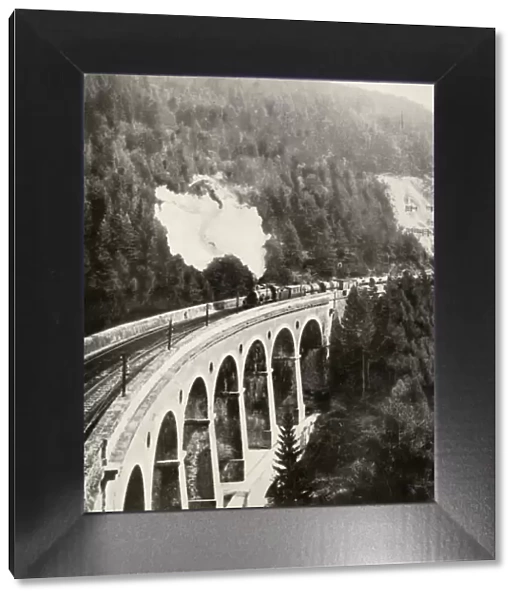 In the Semmering Valley, Austria. A good train crossing the curved Gamperl Viaduct, 1935-36