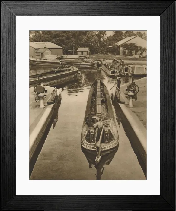 Framed Print : Pushing a Monkey Boat Through The Lock at Brentford, c1935. Creator: Unknown Framed Print : Pushing a Monkey Boat Through The Lock at Brentford, c1935. Creator: Unknown