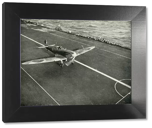 RAF Spitfire on the deck of an aircraft carrier on its way to Malta, World War II, 1942 (1944)