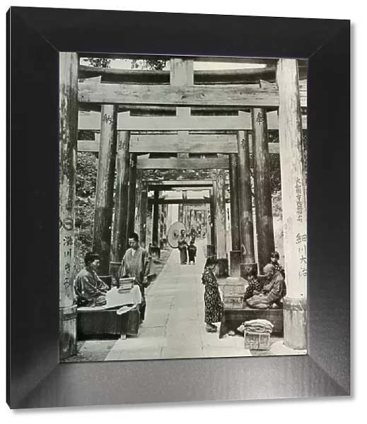 An Avenue of Torii at Inari, 1910. Creator: Herbert Ponting