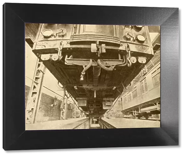 Under the Underground: Beneath a District Railway Electric Car, 1930. Creator: Unknown