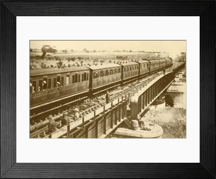 Framed Print : A Train Passing Over The Bridge, c1930. Creator: Unknown