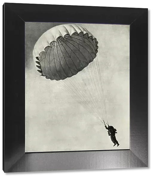 Airman using a parachute during the Second World War, 1941. Creator: Charles Brown