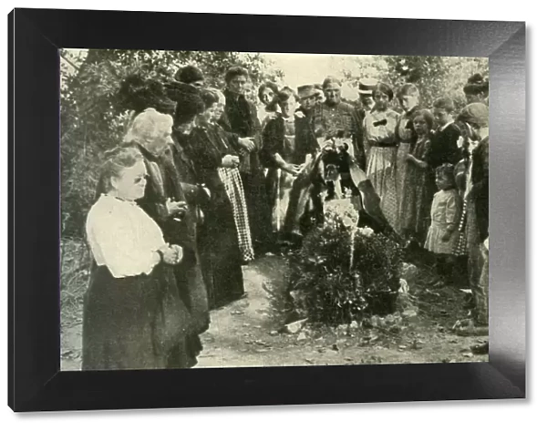 French civilians at the grave of a soldier, 1914, (c1920). Creator: Unknown