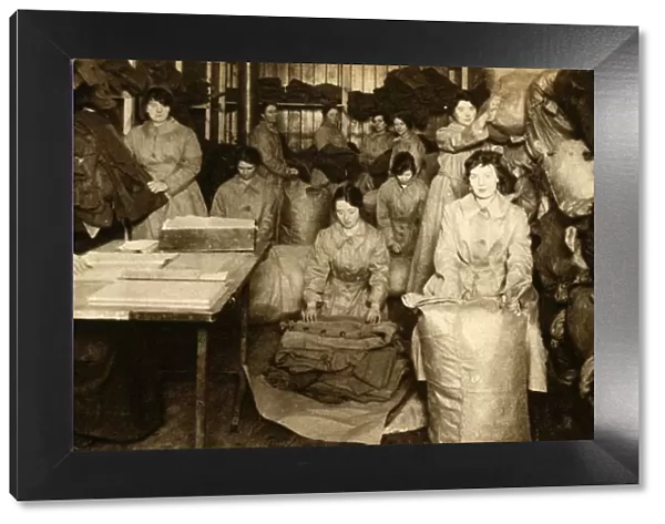 Sorting uniforms at the WaC clothing store, First World War, 1914-1918, (1933). Creator: Unknown