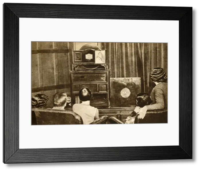 Framed Print : People watching an early television broadcast, c1930, (1933). Creator: Unknown Framed Print : People watching an early television broadcast, c1930, (1933). Creator: Unknown