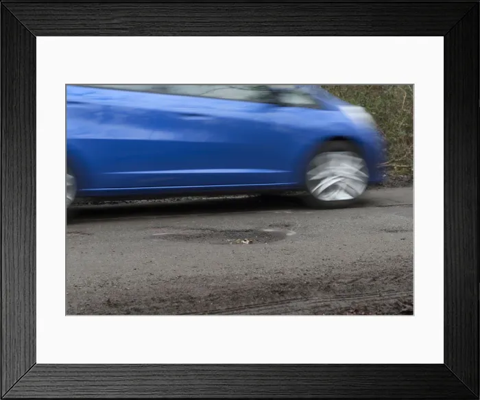 Framed Print : Pot holes in road surface 2017. Creator: Unknown