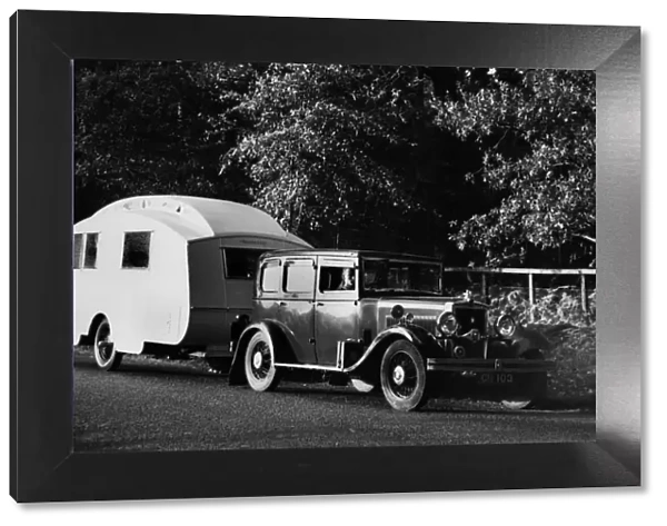 1931 Morris Isis saloon with Winchester caravan. Creator: Unknown