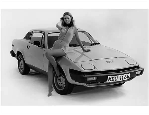 1976 Triumph TR7 with female model. Creator: Unknown