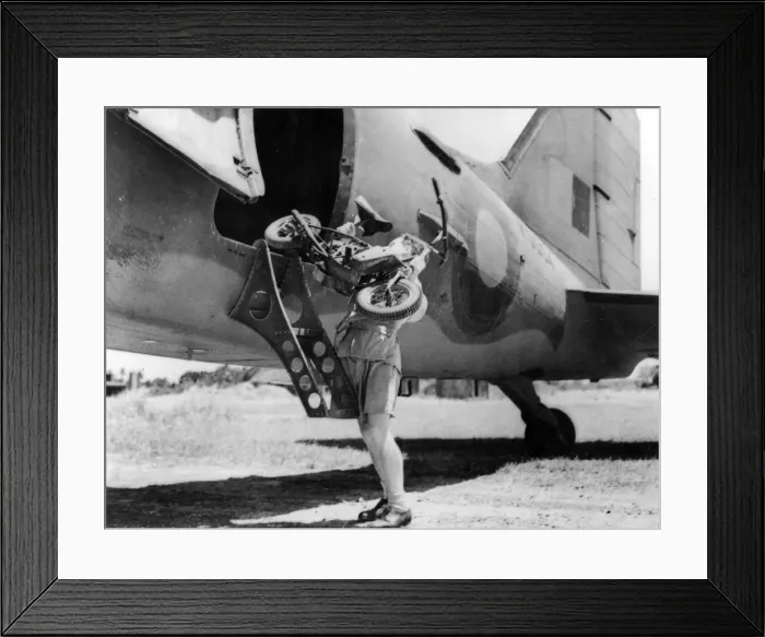 Framed Print : 1944 Welbike being placed on to military transport plane. Creator: Unknown Framed Print : 1944 Welbike being placed on to military transport plane. Creator: Unknown