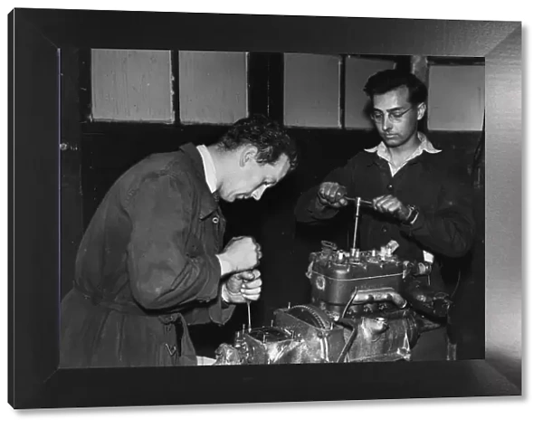 Colin Chapman with Peter Allen in Lotus workshop. Creator: Unknown