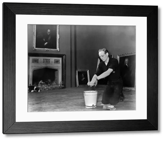 Framed Print : Edward, Lord Montagu of Beaulieu scrubbing floors in Palace House 1952. Creator: Unknown