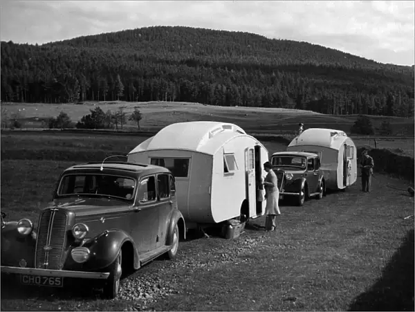 1937 Hillman 14 towing caravan. Creator: Unknown