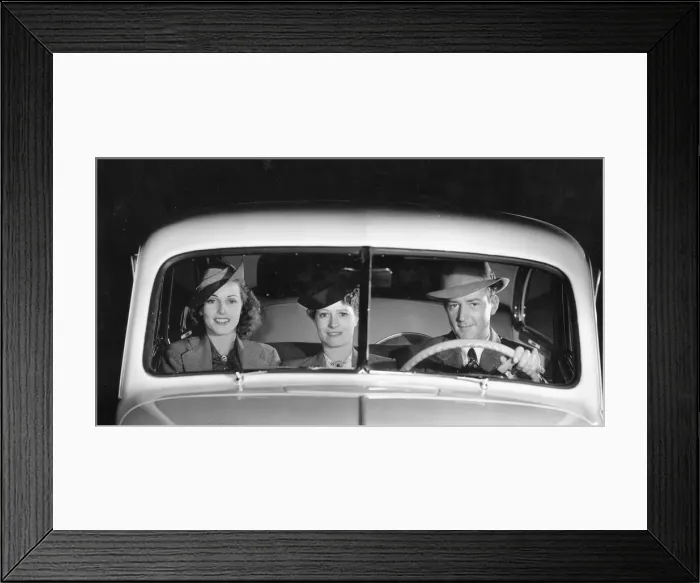 Framed Print : 1939 Oldsmobile driver and female passengers. Creator: Unknown Framed Print : 1939 Oldsmobile driver and female passengers. Creator: Unknown
