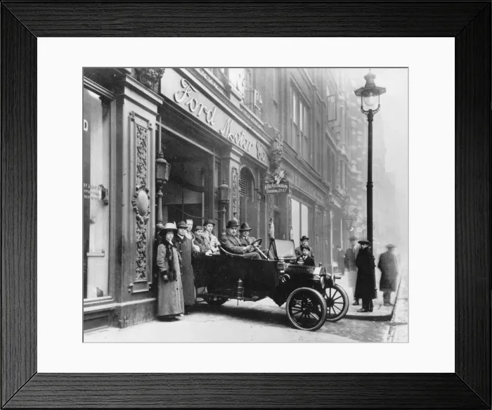 Framed Print : Ford Model T leaving showroom circa 1911. Creator: Unknown Framed Print : Ford Model T leaving showroom circa 1911. Creator: Unknown