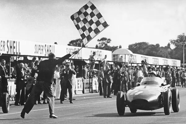 Stirling Moss winning 1957 British Grand Prix at Aintree in the Vanwall. Creator: Unknown