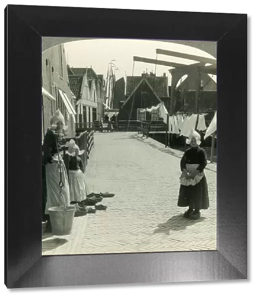 Washday in Volendam, Netherlands - Shoes Large and Small and Some Who Wear Them, c1930s