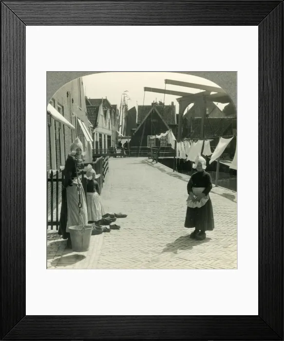 Framed Print : Washday in Volendam, Netherlands - Shoes Large and Small and Some Who Wear Them, c1930s Framed Print : Washday in Volendam, Netherlands - Shoes Large and Small and Some Who Wear Them, c1930s