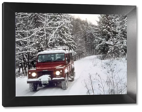 2001 Land Rover Defender driving in snowy conditions. Creator: Unknown