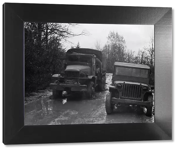 GMC 352 CCKW and Willys Jeep circa 1944. Creator: Unknown