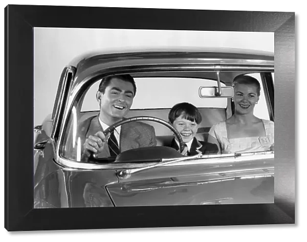 1957 Vauxhall Victor with family together in front seat. Creator: Unknown