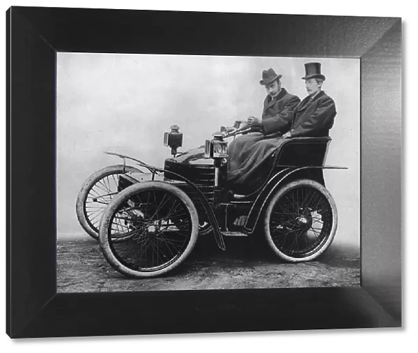 Herbert Austin at tiller of first 4 wheel Wolseley 1899. Creator: Unknown