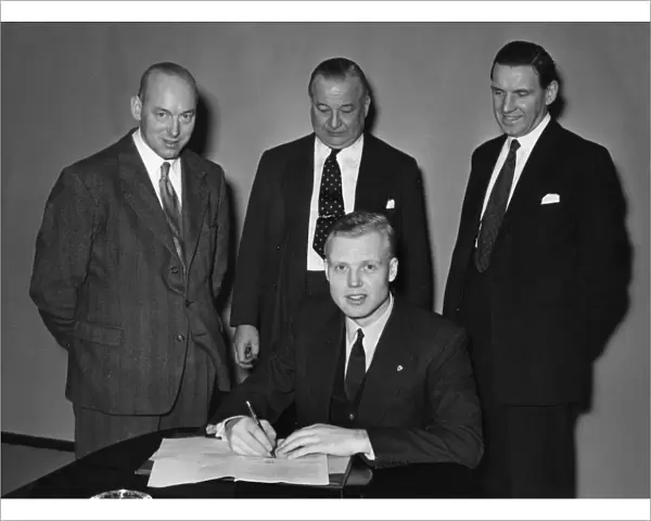 Mike Hawthorn signing Vanwall contract 1955. Creator: Unknown