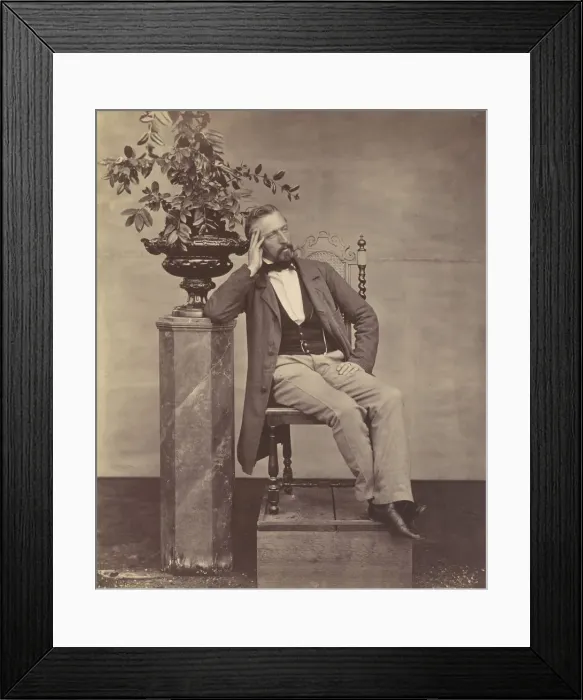 Framed Print : [Mathias Housermann seated with elbow on pedestal holding a vase of flowers]
