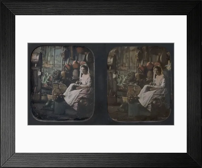 Framed Print : [Woman in Apron and Bonnet Grinding Coffee in Kitchen Setting], 1850s. Creator: Unknown