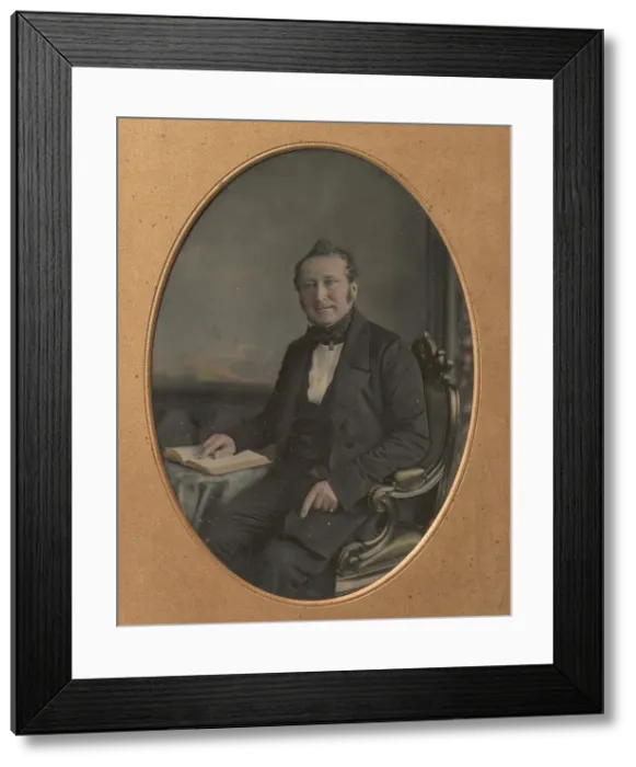 Framed Print : Seated Man Pointing to a Passage in an Open Book, 1850s. Creator: John Jabez Edwin Mayall Framed Print : Seated Man Pointing to a Passage in an Open Book, 1850s. Creator: John Jabez Edwin Mayall