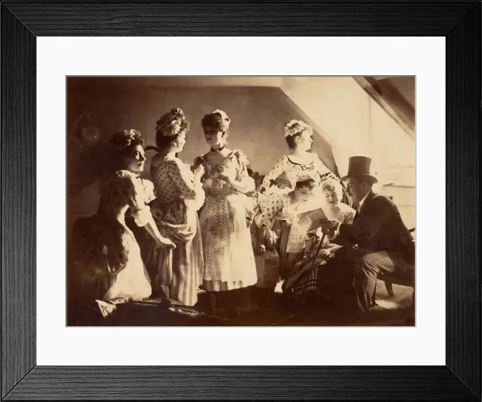 Framed Print : A Group of Six Costumed Women Posed in Interior with Top Hatted Gentlemen, c1885 Framed Print : A Group of Six Costumed Women Posed in Interior with Top Hatted Gentlemen, c1885