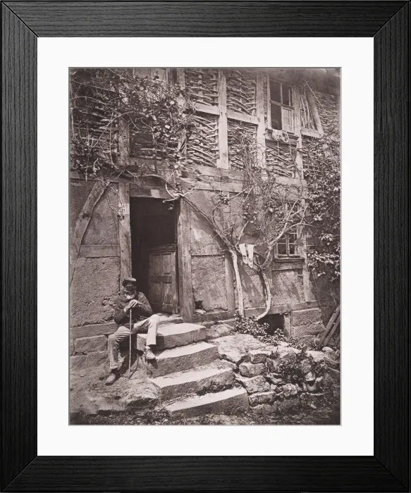 Framed Print : [Man Sitting on Steps of House with Socks Hanging on Nearby Vine to Dry], 1880s